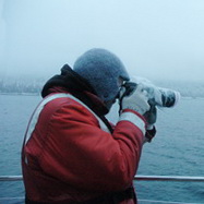 Researcher photographing whales in Seymour Canal, Alaska 